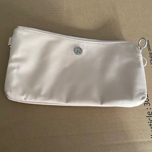 LULU blush pink wristlet style little bag.